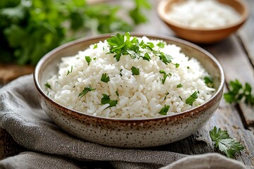 Steamed white rice with parsley garnish high resolution picture