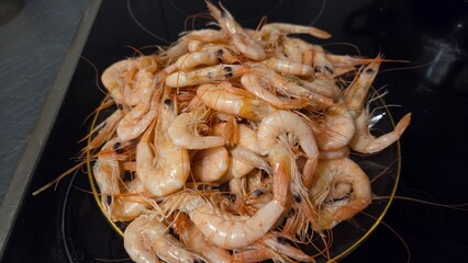 Fresh shrimp pile on plate for culinary art and seafood cooking inspiration