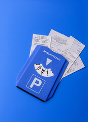 A parking disc, permit, or ticket for measuring time and paying municipal services. A parking disc