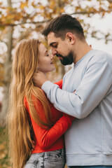 Fototapeta premium autumn park nurtures silent intimacy, soft touches and autumn scenery evoke deep mutual understanding