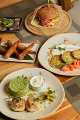 assorted cuisine for sharing, diverse assortment of dishes arranged for group dining experience
