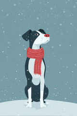Black and white dog wearing a red scarf sitting in falling snow against a soft winter background
