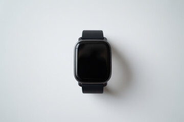 High-angle minimalist studio photo of a black smartwatch on a white surface, perfect for high-resolution technology product display