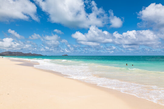 Waimānalo Beach Park, Honolulu, Windward Coast Oahu, Hawaii. Pacific Ocean. Cumulus clouds are clouds that have flat bases and are often described as puffy, cotton-like, or fluffy in appearance. 