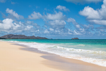 Waimānalo Beach Park, Honolulu, Windward Coast Oahu, Hawaii. Pacific Ocean. Cumulus clouds are clouds that have flat bases and are often described as puffy, cotton-like, or fluffy in appearance. 