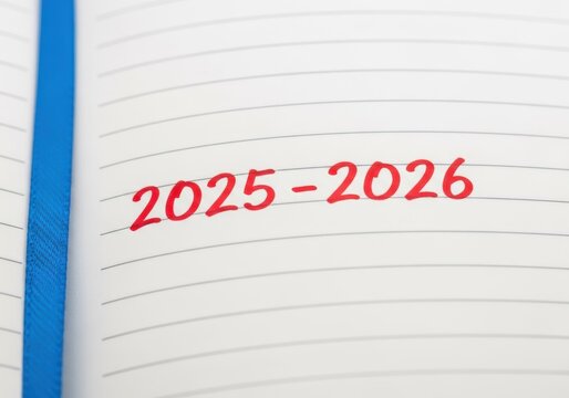 2025-2026 written in red marker on a lined notebook page, planning concept