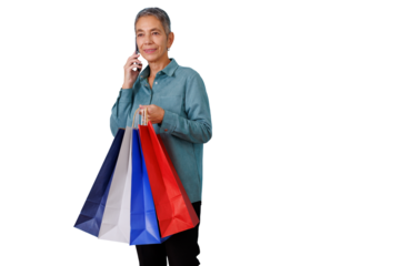 Mature woman shopping, holding colorful bags and talking on mobile phone, enjoying modern retail experience on transparent background