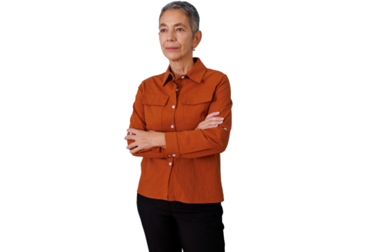 Mature senior woman with crossed arms expressing confidence and professionalism, standing against a transparent background