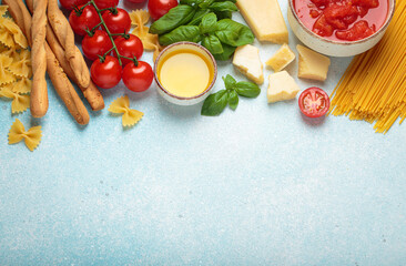 Italian food cuisine background featuring tomato sauce, grissini, pasta, parmesan, fresh basil