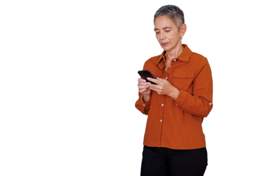 Mature woman standing, using a mobile phone, browsing on transparent background, connecting online, digital communication
