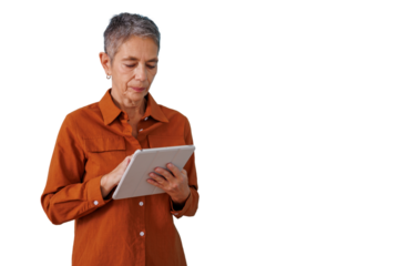 Senior woman using a digital tablet, staying connected and embracing modern technology, on transparent background
