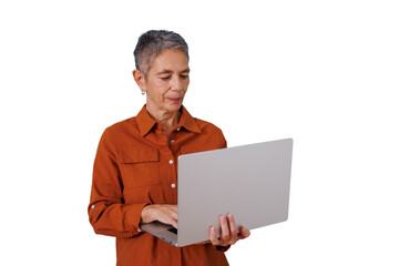 Senior woman standing, working on laptop, typing on keyboard, embracing modern technology, transparent background