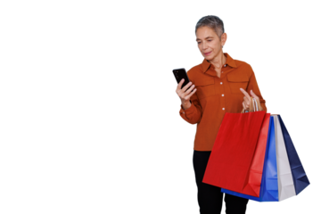 Senior woman shopping online with smartphone, holding colorful paper bags, consumerism, transparent background