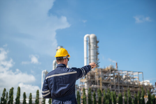 Refinery industry, engineer working in industrial production, oil and gas refinery plant industry factory, Petrochemical plant
