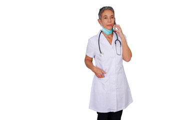 Medical woman engaged in a phone call, wearing a white coat, stethoscope, and a face mask under her chin, transparent background