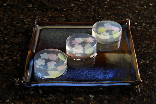 Kingyoku Kan is a translucent Japanese gelatin made with agar-agar (a seaweed gelatin) that is decorated with fruits or other elements to create beautiful scenes, like a work of art.