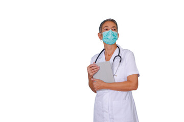 Mature female doctor wearing face mask and stethoscope holding digital tablet, looking away