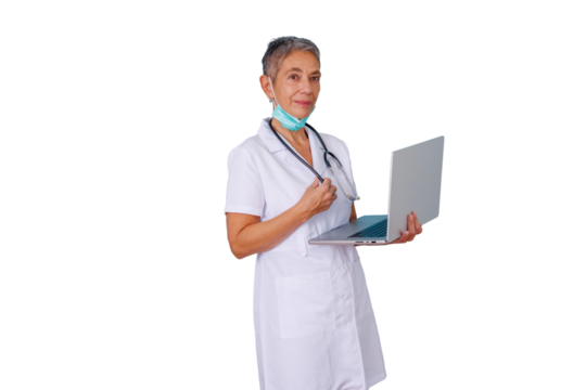 Senior female doctor wearing white uniform and mask around neck, holding stethoscope and laptop, smiling at camera