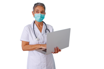 Senior woman doctor or nurse wearing a face mask and stethoscope, holding and typing on a laptop, providing medical care