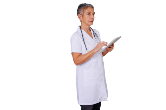 Senior woman doctor wearing a lab coat and stethoscope, using a tablet for healthcare information and patient data