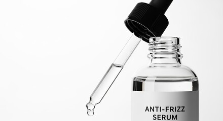 Anti-frizz serum bottle with dropper on white background  