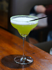 A glass with margarita cocktail with lime. High quality photo