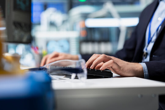 Professional energy analyst in a suit examines solar panel diagnostics, highlighting the integration of industrial expertise and business intelligence in photovoltaics renewable power.