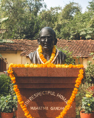 A stone statue of Mohandas Gandhi at an NGO in Mayurbhanj, Odisha, India in December 2024