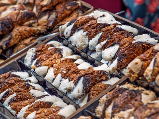 Traditional Sicilian Cannoli with Varied Fillings Displayed