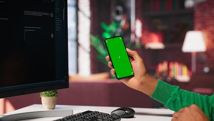 Black freelancer using AI assistant for auto generated solutions and mockup, solves tasks via chatbot web interface. Advanced machine learning and smart algorithms help with efficiency. Camera A.