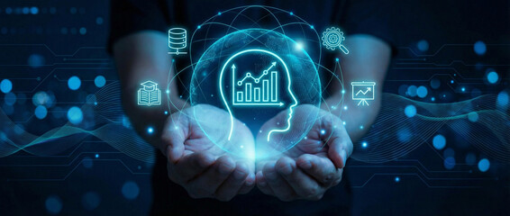 Business Intelligence and Skill Development: Hands hold a digital head interface with a growth graph and analytics icons.