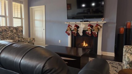 christmas holiday living room with cozy fireplace and festive stockings - Powered by Adobe