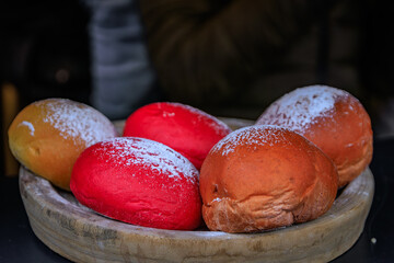 Colorful Christmas brioche buns with sugar, Christmas market in Colmar, France