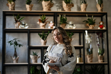 Smiling woman small business owner florist shop