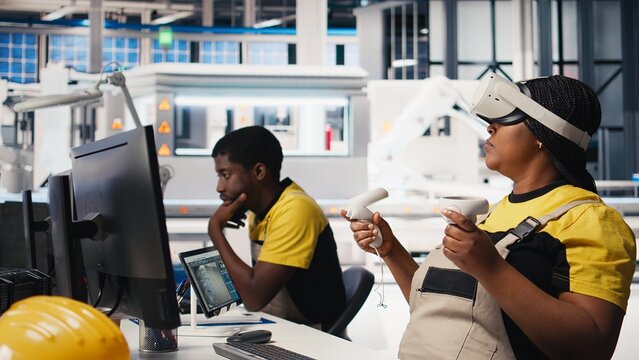 Photovoltaics factory engineer using VR tech to build models of alternative energy generators. Solar panels plant female employee building safe solar cells using virtual reality gear. Camera B.