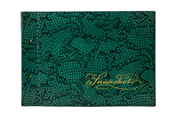 An old album cover with a green crocodile texture and the words 