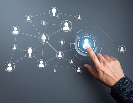 Finger taps glowing social network node on gray backdrop