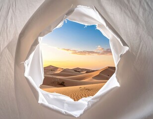 Desert seen through a torn white fabric