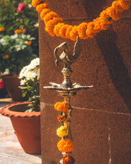 A metal ritual lamp at an NGO in Mayurbhanj, Odisha, India, in December 2024