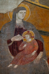Fresco (13h century) of Blessed Virgin Mary holding baby Jesus Christ in her arms.