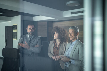 Business colleagues having meeting in modern office boardroom