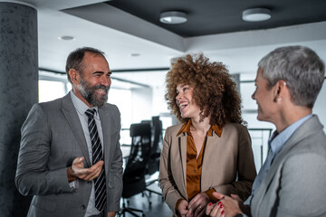 Diverse business team having happy discussion in office
