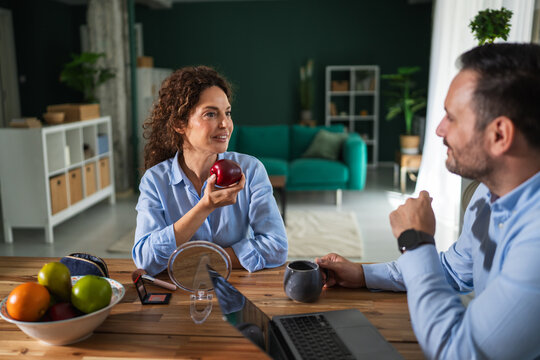Couple having healthy breakfast and conversation at home