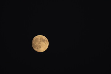 A detailed photograph of the waxing gibbous moon captured on October 5, 2025, at 7:01 p.m., showing bright lunar surface features against a dark night sky.