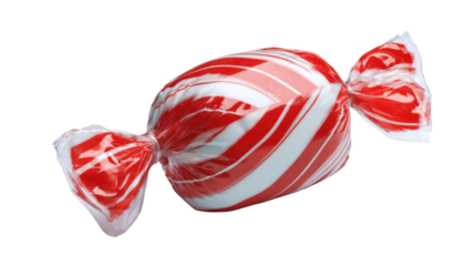 Red and white striped peppermint candy wrapped in transparent plastic creating festive sweet confectionery treat for holiday and seasonal themes on white background