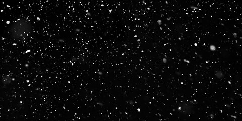 Falling snowflakes out of focus on black background for overlay blending mode. Snowing, snowfall, snow on black, selective focus