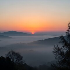 Obraz premium Sunrise painted canvas, mist veils mountain ridges, soft light illuminating the tranquil landscape creating a peaceful