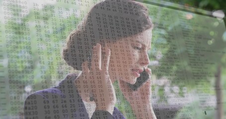 Speaking woman in dark blazer and light blouse adjusting headset by glass window, with code overlay