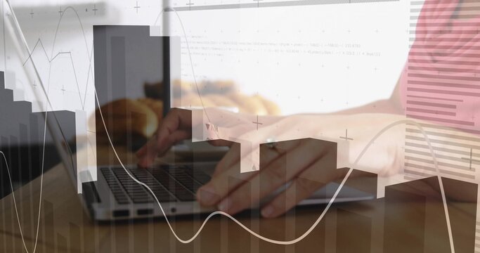 Typing person's hands with ring pressing laptop keys on wooden table, cup, charts, striped top - Powered by Adobe