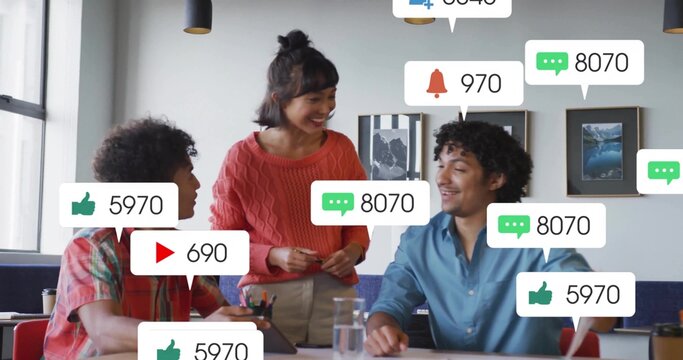 Standing woman in rust sweater guiding men in plaid and blue shirts in office, laptop alerts - Powered by Adobe